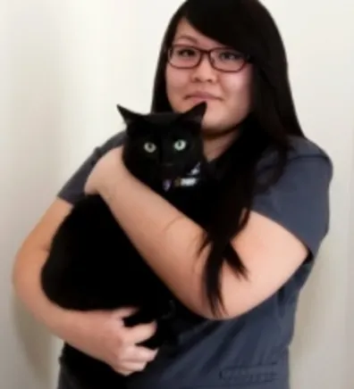 Annie Holding a Black Cat